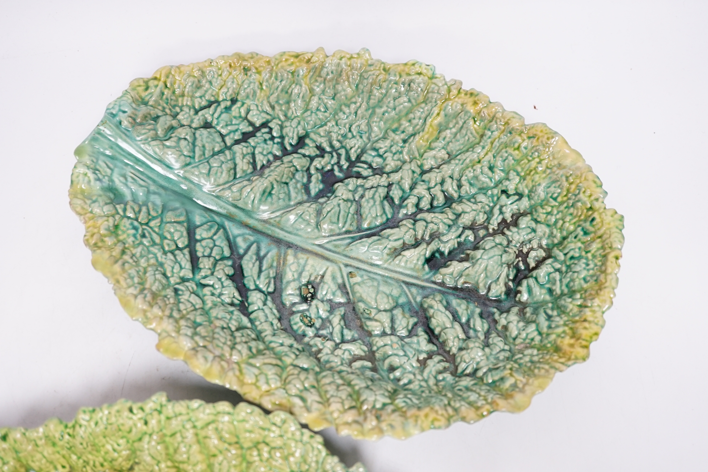 A pair of Zsolnay cabbage leaf dishes, largest 32cm